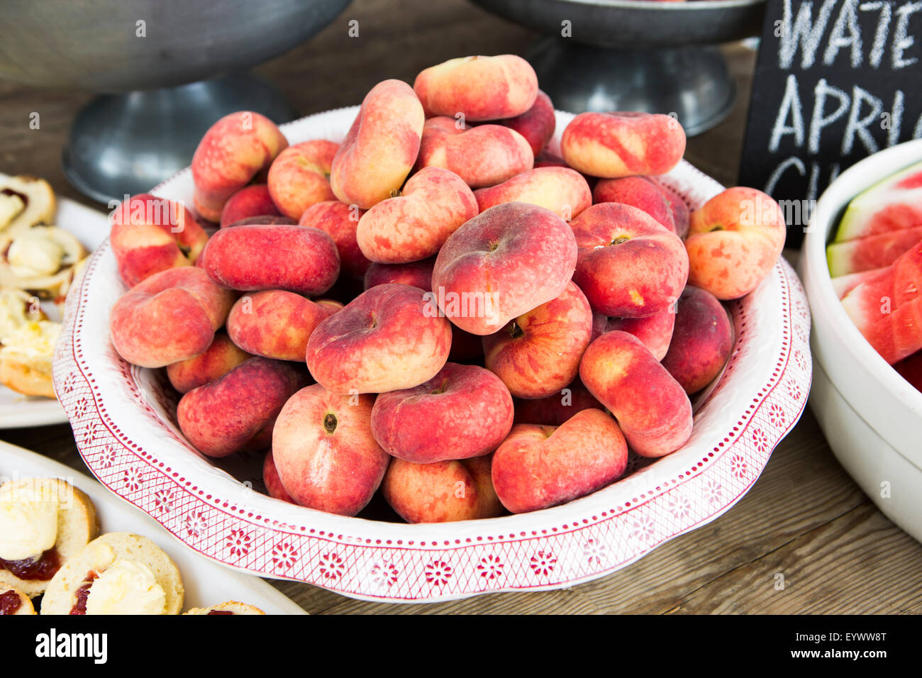 Peaches in floral vintage bowl. Stock Photo