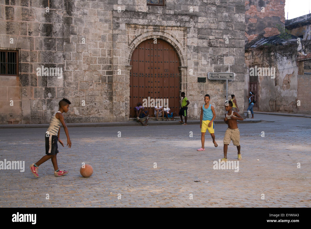 Kids playing soccer in an empty square in Old Havana, Cuba. Stock Photo
