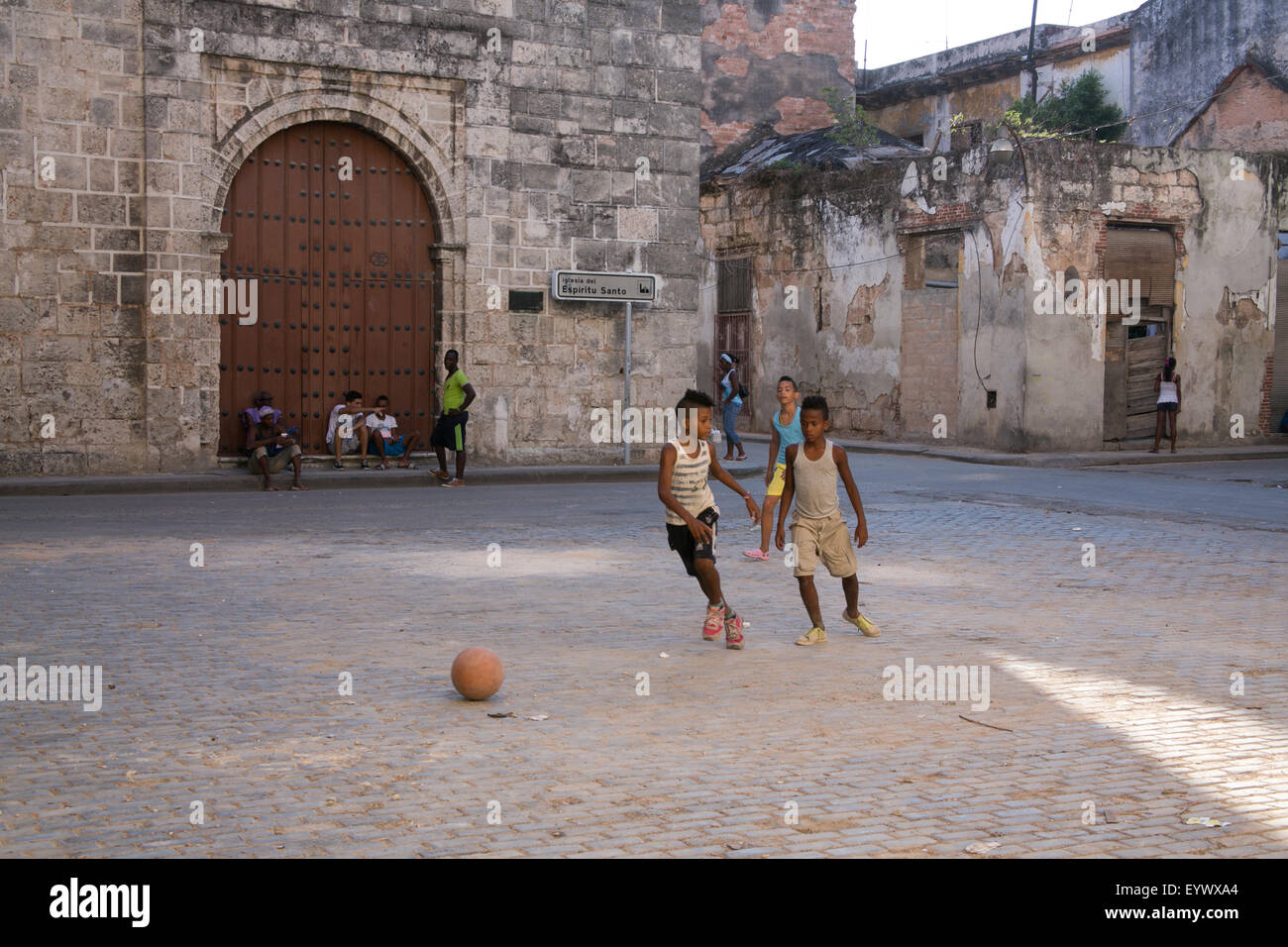 Kids playing soccer in an empty square in Old Havana, Cuba. Stock Photo