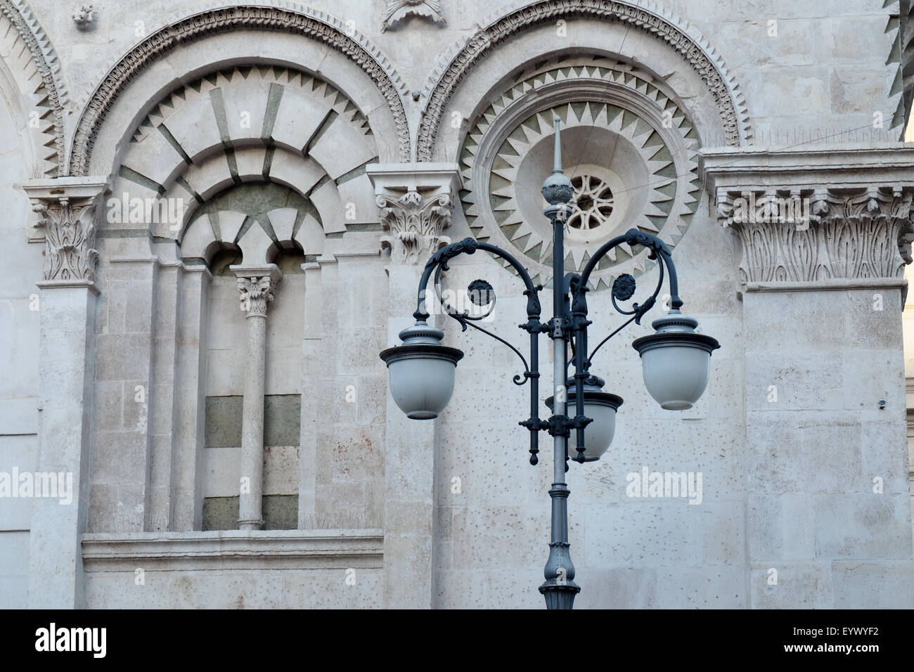 Ornate street lighting and Romanesque facade of Church of Our Lady of the Assumption, Foggia. Stock Photo