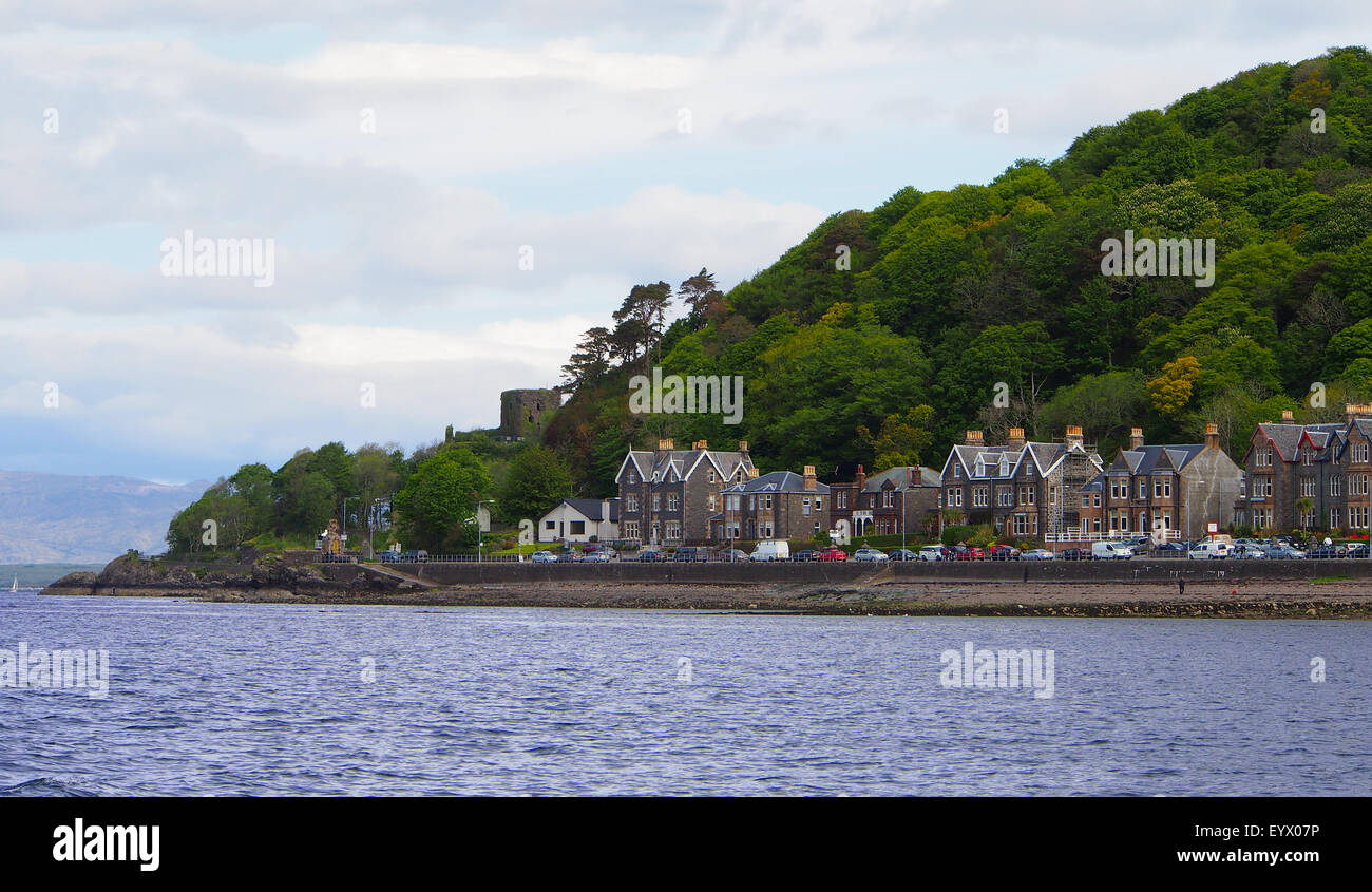 The coastal town of Oban, Argyll in Scotland, UK with the hills behind, photographed from out at sea. Stock Photo