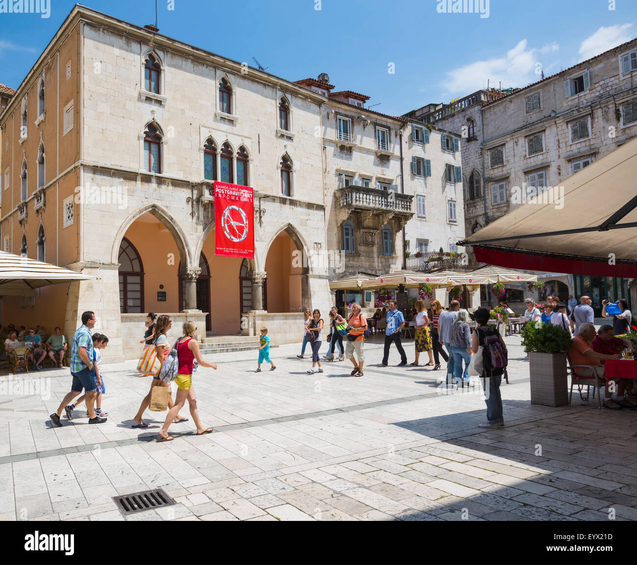 Split, Dalmatian Coast, Croatia.  People's Square.  The red banner hangs from the 15th century Renaissance Town Hall. The Histor Stock Photo