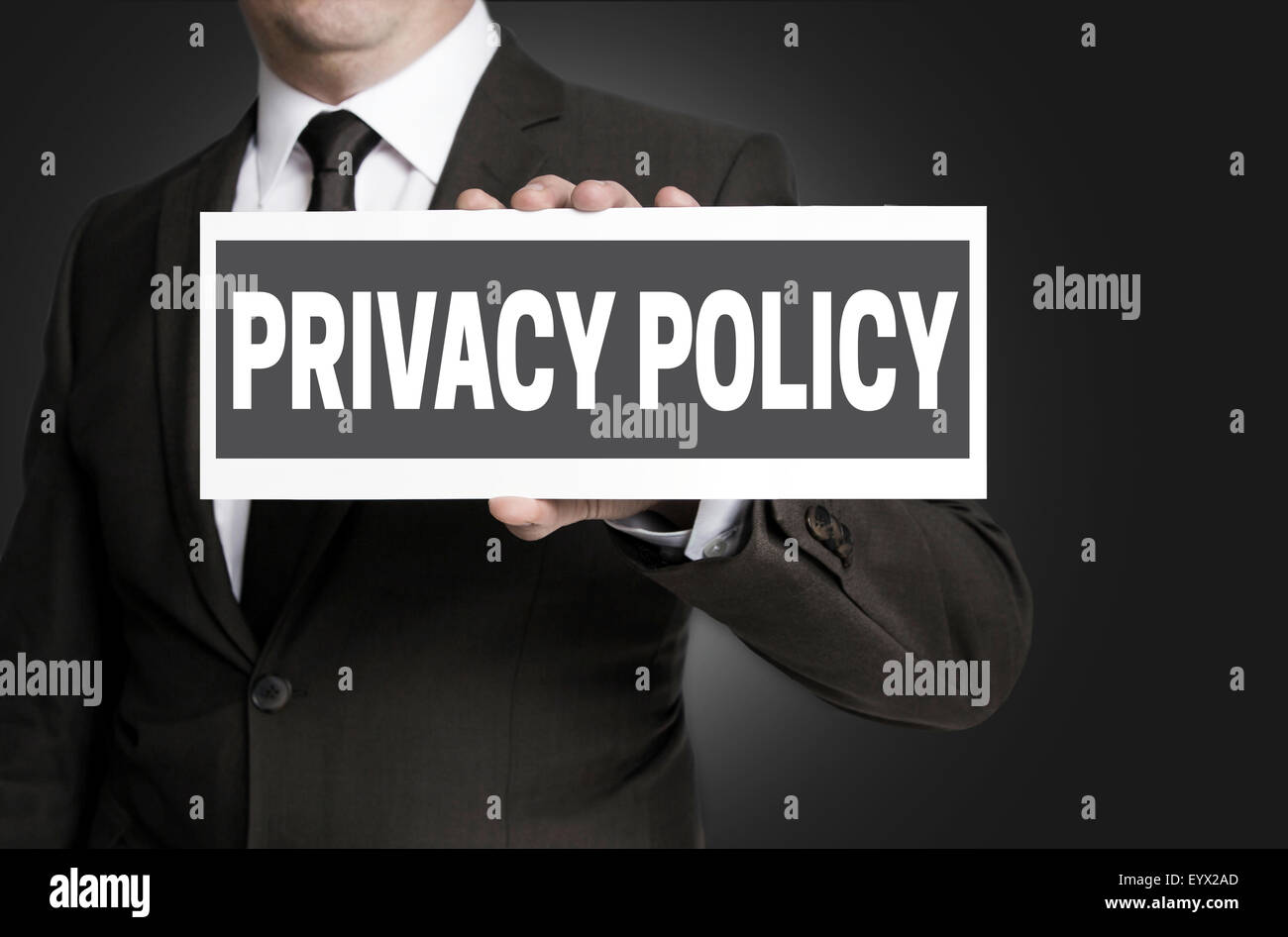 Privacy Policy sign is held by businessman. Stock Photo