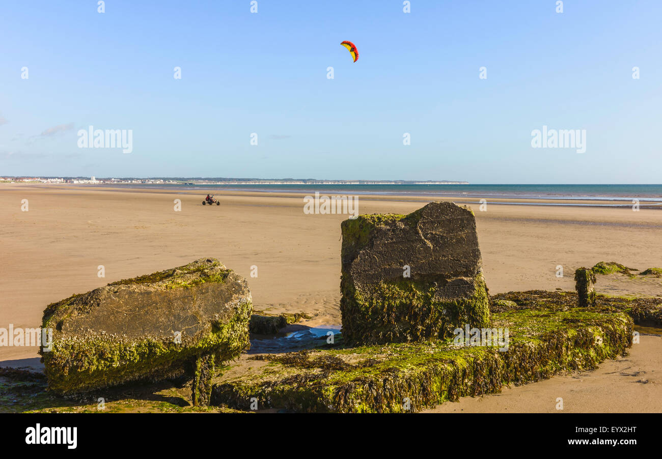 Unidentified man go-karts with parachute on beach on a sunny day in Yorkshire, UK. Stock Photo