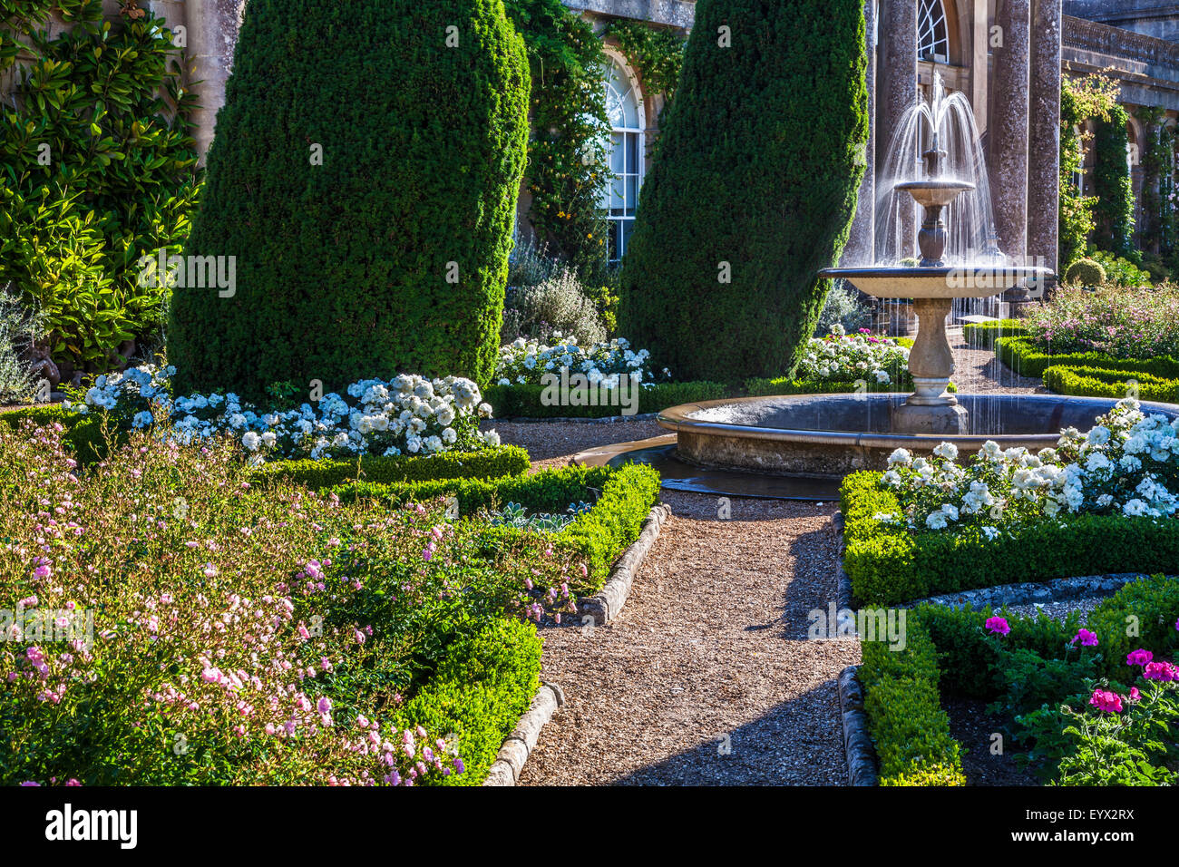 Roses and a fountain on the terrace of Bowood House in Wiltshire. Stock Photo