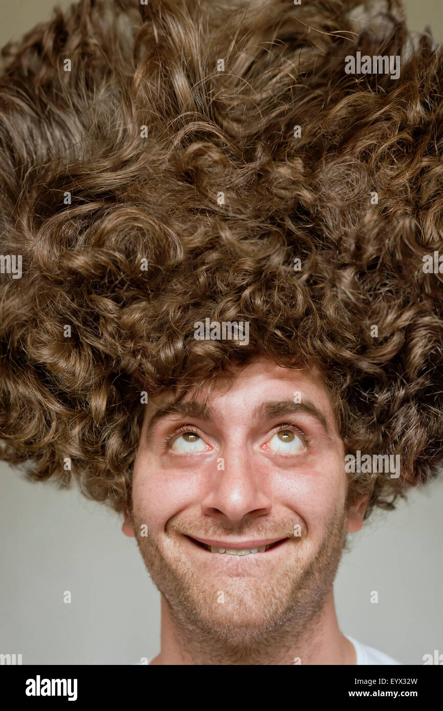 Scruffy faced man with messy curly hair afro Stock Photo - Alamy