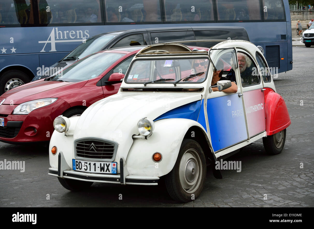 A classic Citroen 2CV in traffic in Paris. Stock Photo