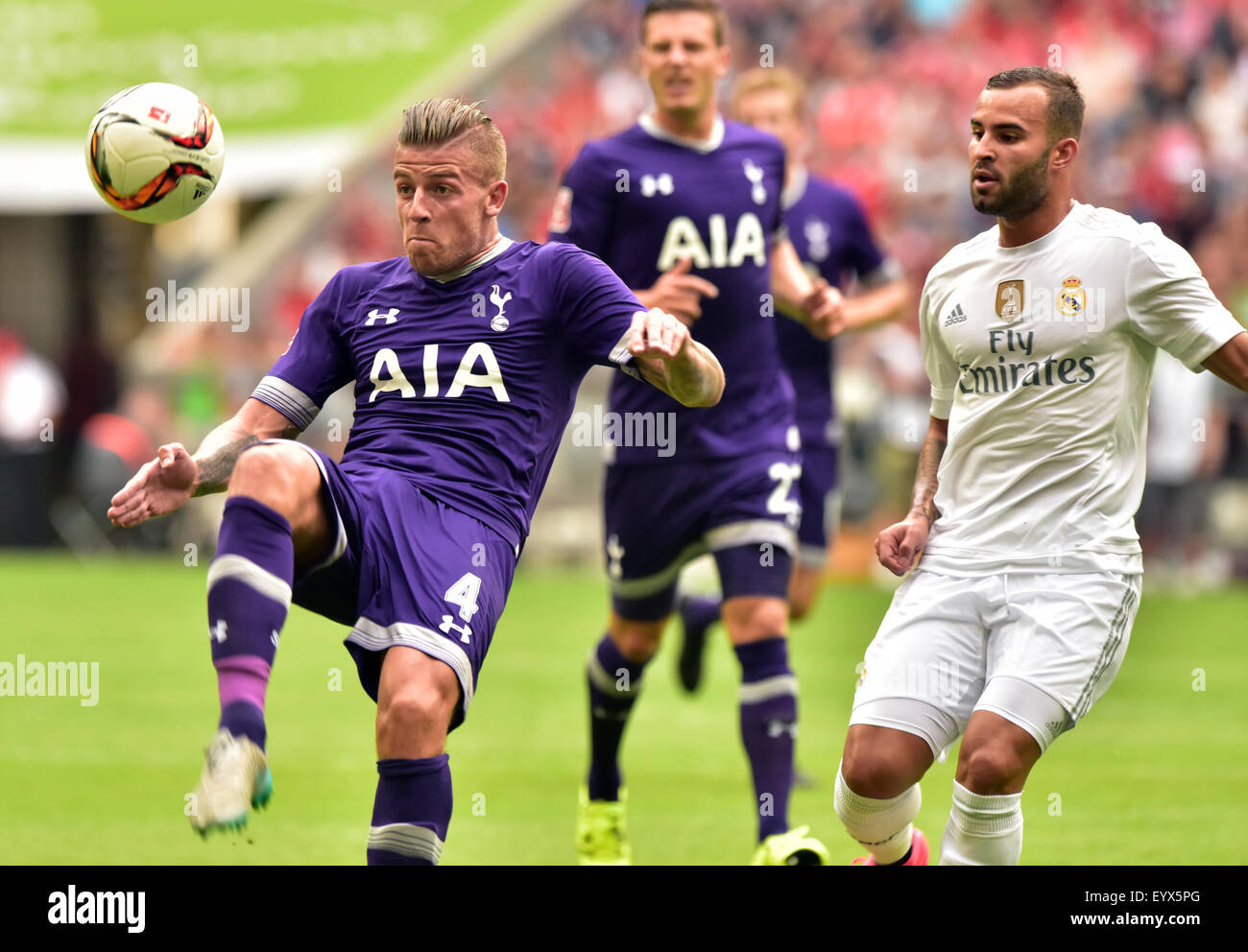 Munich, Germany. 4th Aug, 2015. Real Madrid's Jese (r) and Tottenham's Toby Alderweireld compete for the ball during the Audi Cup soccer friendly between Real Madrid and Tottenham Hotspur in Munich, Germany, 4 August 2015. PHOTO: PETER KNEFFEL/DPA/Alamy Live News Stock Photo