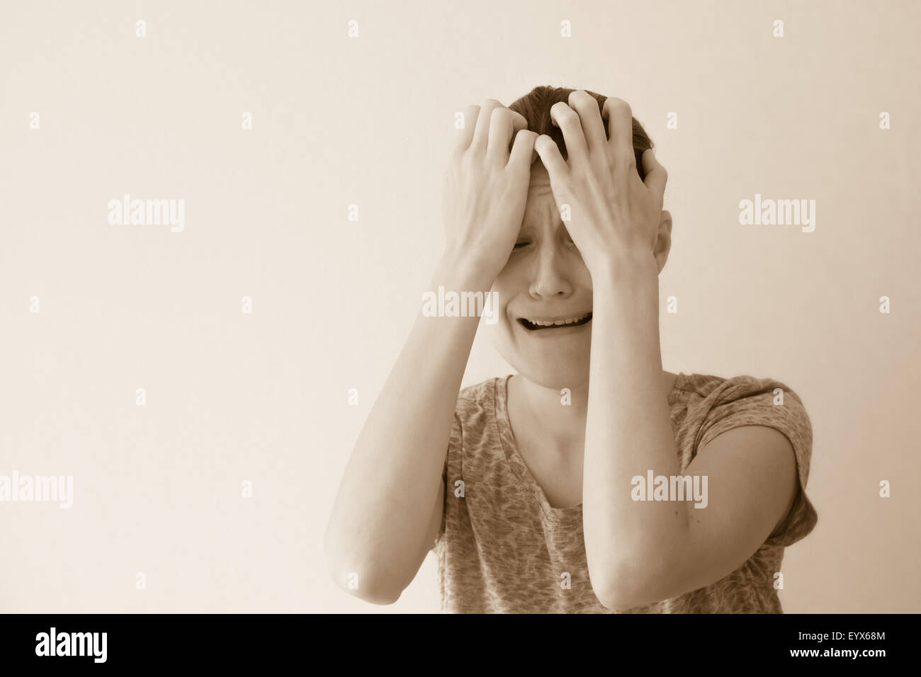 Crying depressed sad abuse young woman, dramatic portrait Stock Photo