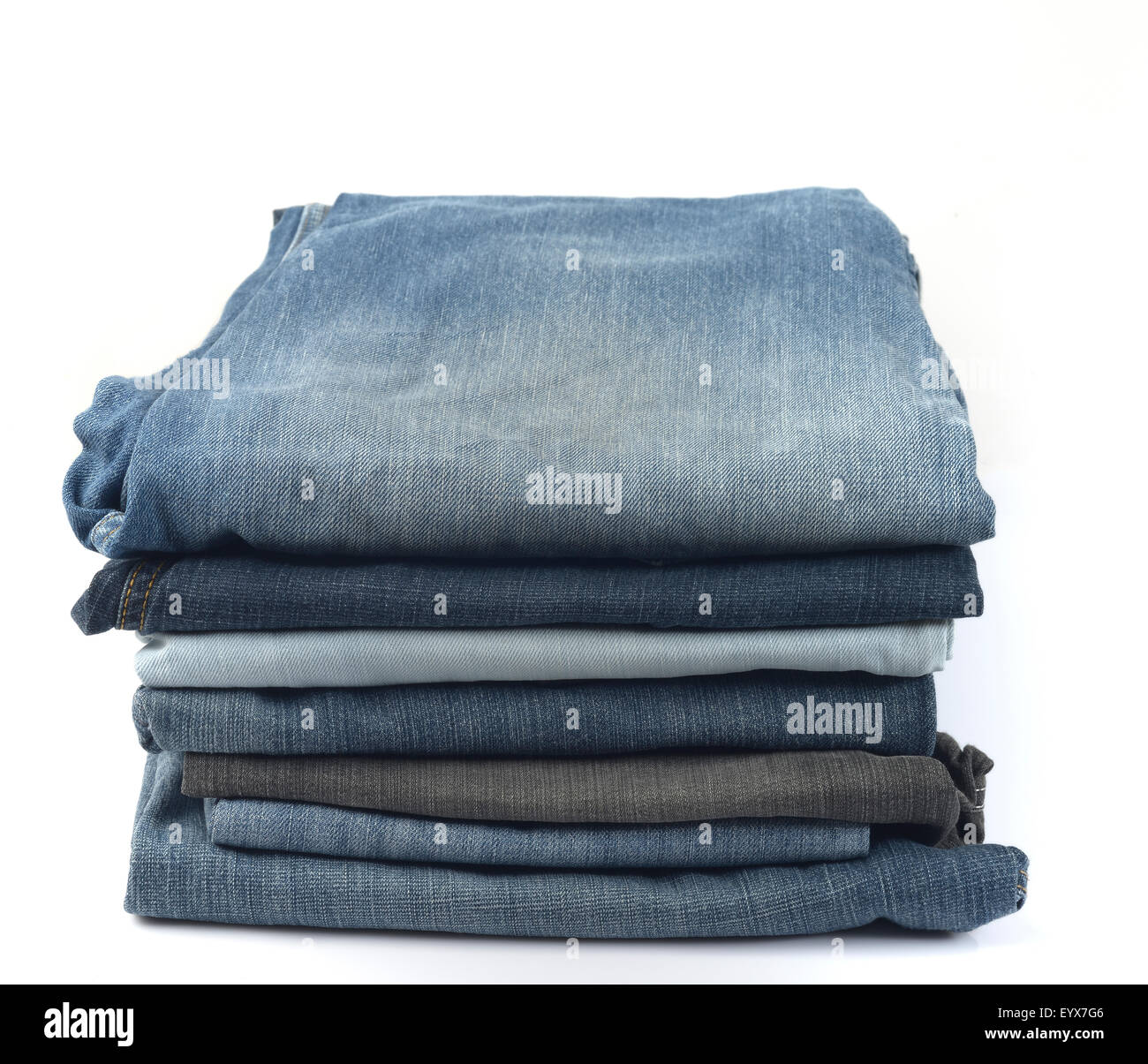 Stack of Blue and Black Jeans on White Background Stock Photo - Alamy