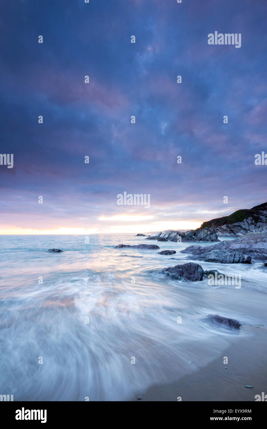 Sunset over Sharrow Beach Whitsand Bay Cornwall UK Stock Photo