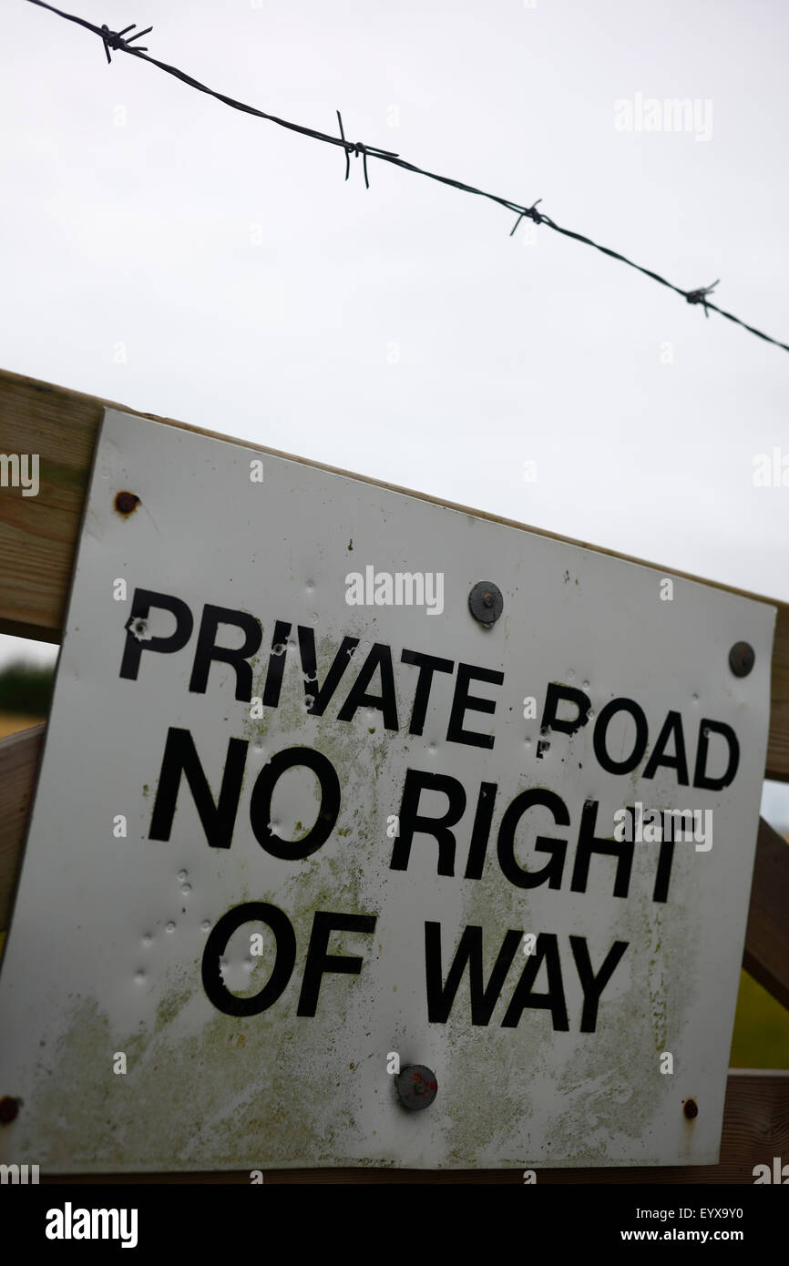 'PRIVATE ROAD NO RIGHT OF WAY' sign on a gate. Stock Photo