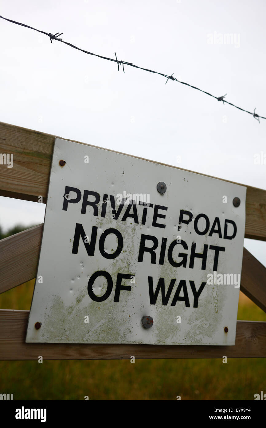 'PRIVATE ROAD NO RIGHT OF WAY' sign on a gate. Stock Photo