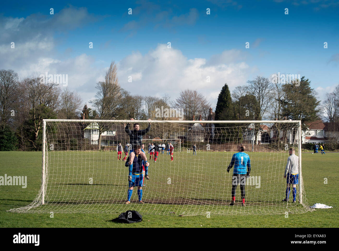 Sunday League amateur footballers putting up the nets at a match in Moseley which is being featured in the urban section of ‘Bes Stock Photo