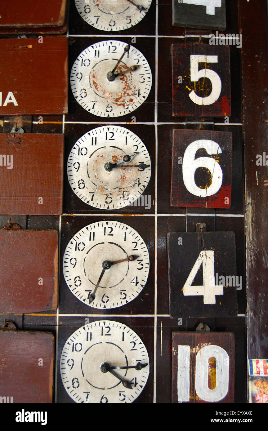timetable clocks at maradana train station, clombo, sri lanka Stock