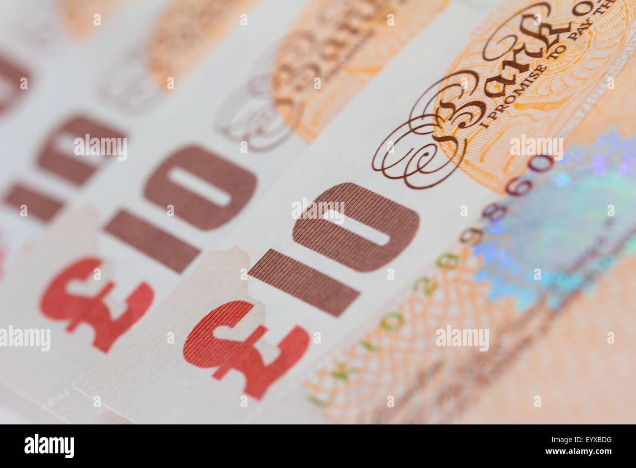 Background of ten UK pound bank notes (sterling) Stock Photo
