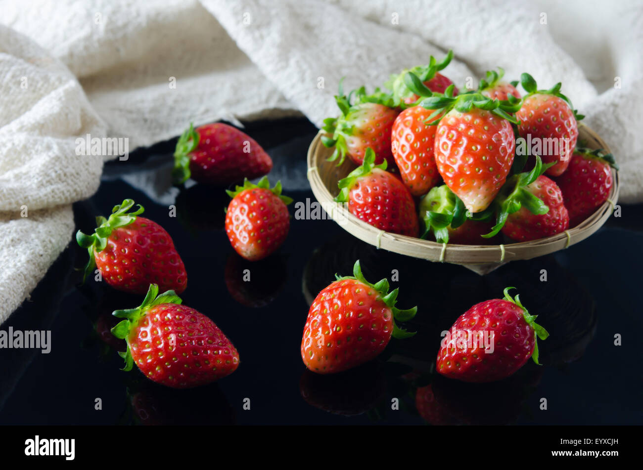 fresh strawberries over black background Stock Photo - Alamy