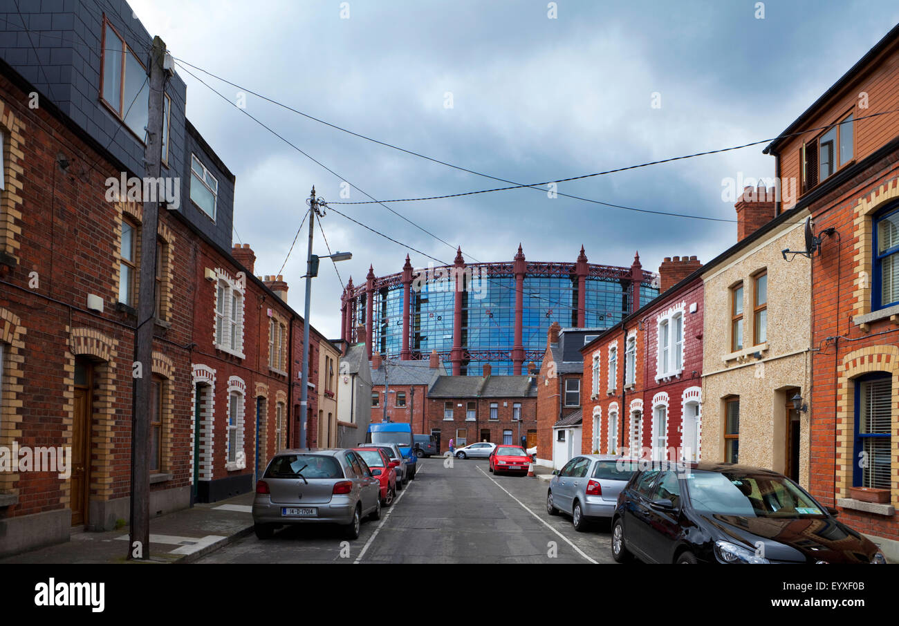 The Gasometer, now converted into apartments rising above small terraced housesin Somerset Street, Dublin City, Ireland Stock Photo