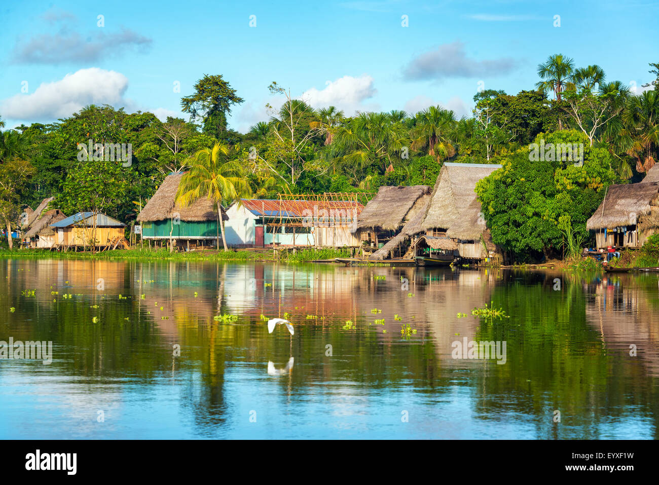 View of a small village in the Amazon rain forest on the shore of the Yanayacu River in Peru Stock Photo