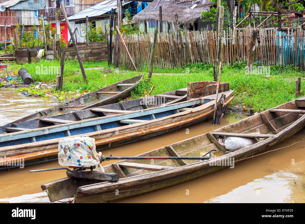 Canoes on the edge of the Amazon River in the town of Tamshiyacu near Iquitos, Peru Stock Photo