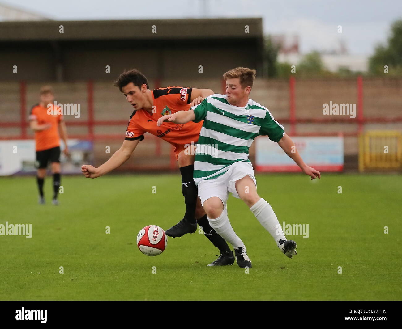 Northwich, Cheshire, UK. 4th August, 2015. Northwich Victoria beat Nantwich Town 2-0 in a pre season friendly held at Witton Albion's Wincham Park in Northwich. Nantwich Town's Ben Hall tussles with Northwich Victoria's Dominic Welsby. Credit:  Simon Newbury/Alamy Live News Stock Photo