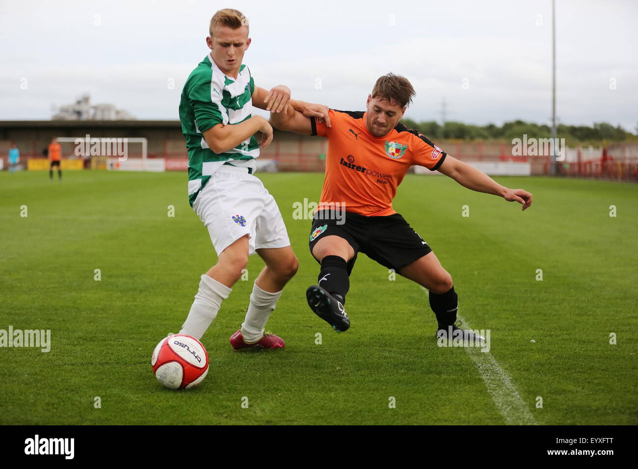 Northwich, Cheshire, UK. 4th August, 2015. Northwich Victoria beat Nantwich Town 2-0 in a pre season friendly held at Witton Albion's Wincham Park in Northwich. Nantwich Town's PJ Hudson in a tackle with Northwich's Matthew Todd. Credit:  Simon Newbury/Alamy Live News Stock Photo