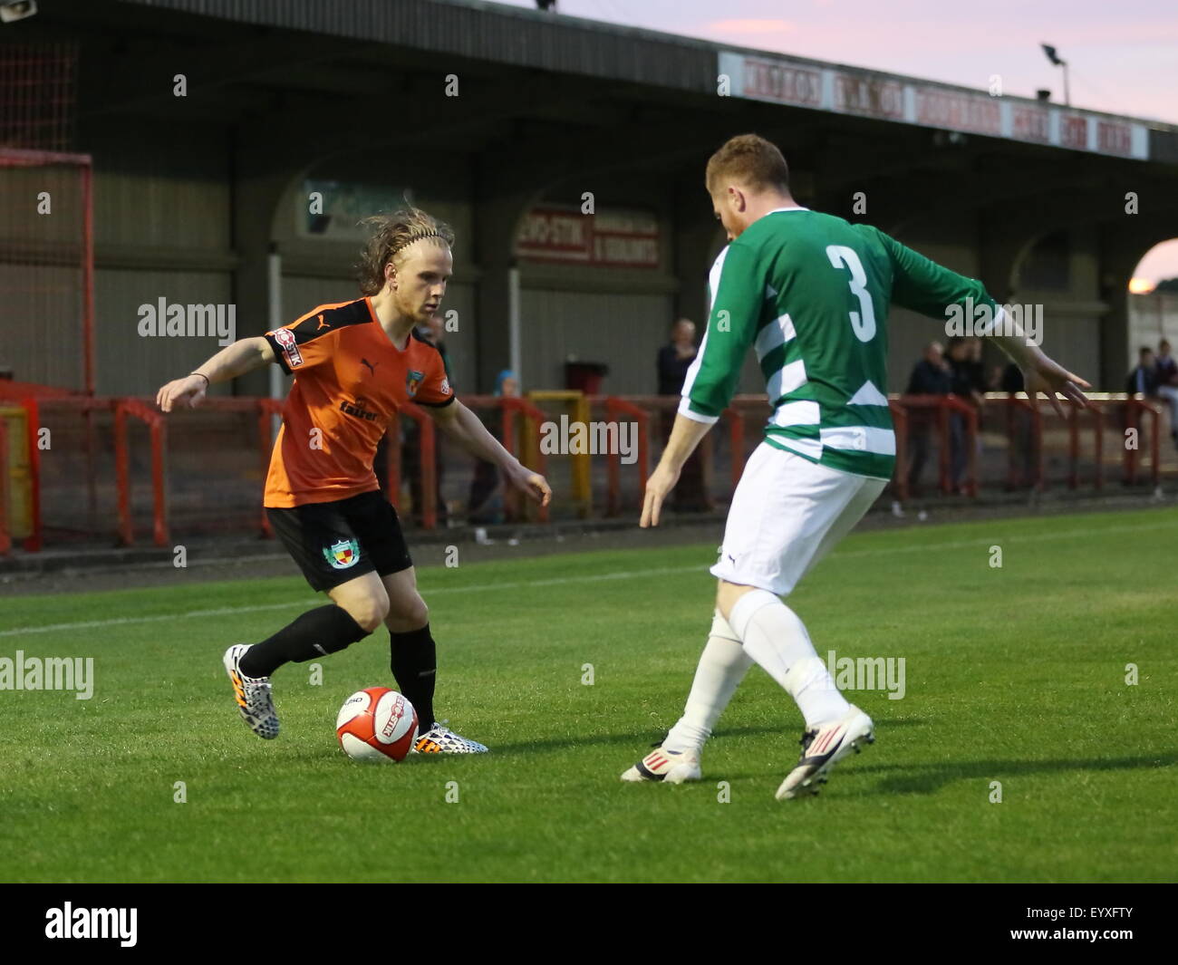 Northwich, Cheshire, UK. 4th August, 2015. Northwich Victoria beat Nantwich Town 2-0 in a pre season friendly held at Witton Albion's Wincham Park in Northwich. Nantwich Town's Matty Kosylo tries to break into the box against Northwich defender Anthony Smart Credit:  Simon Newbury/Alamy Live News Stock Photo