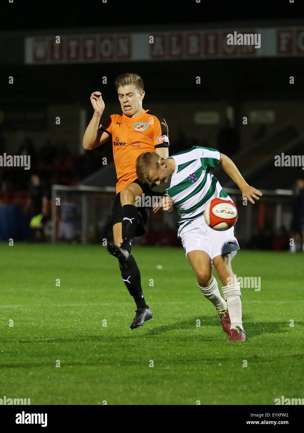 Northwich, Cheshire, UK. 4th August, 2015. Northwich Victoria beat Nantwich Town 2-0 in a pre season friendly held at Witton Albion's Wincham Park in Northwich. Nantwich Town's Lewis Short in a tackle. Credit:  Simon Newbury/Alamy Live News Stock Photo