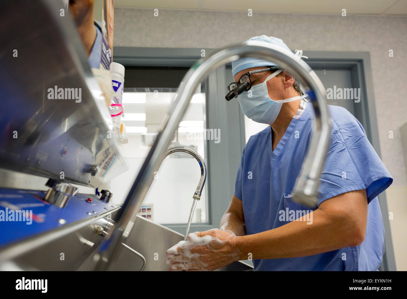 Englewood, Colorado - Dr. Paul Elliott scrubs for surgery at Swedish Medical Center. Stock Photo