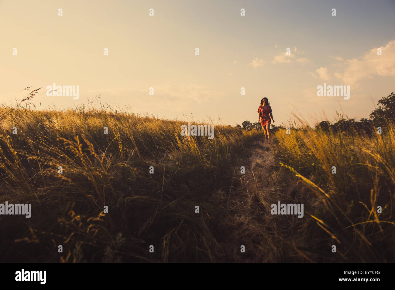 Woman walking away rear dress hi-res stock photography and images - Alamy