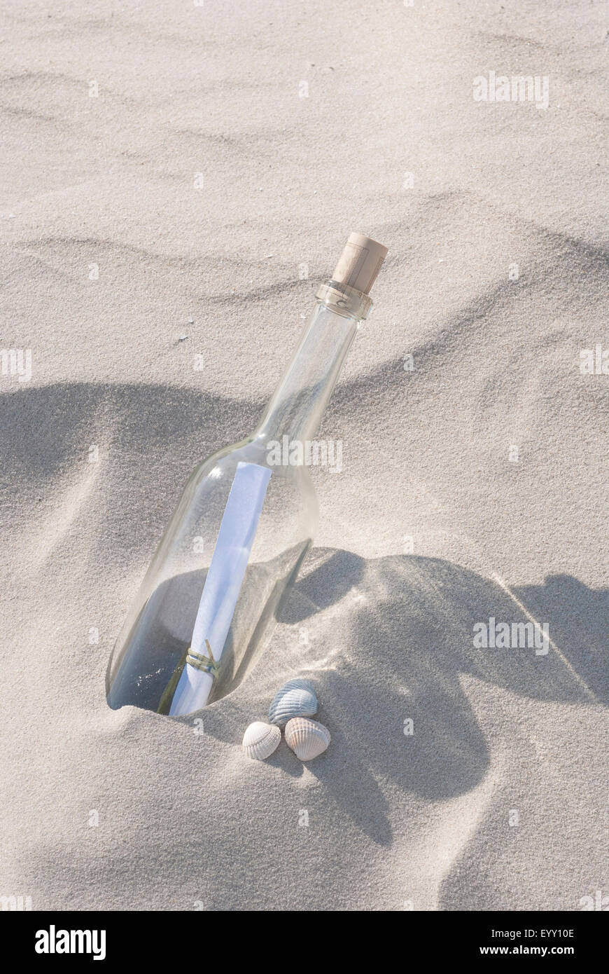 Bottle with a message inside on a sandy beach, North Sea, Schleswig-Holstein, Germany Stock Photo
