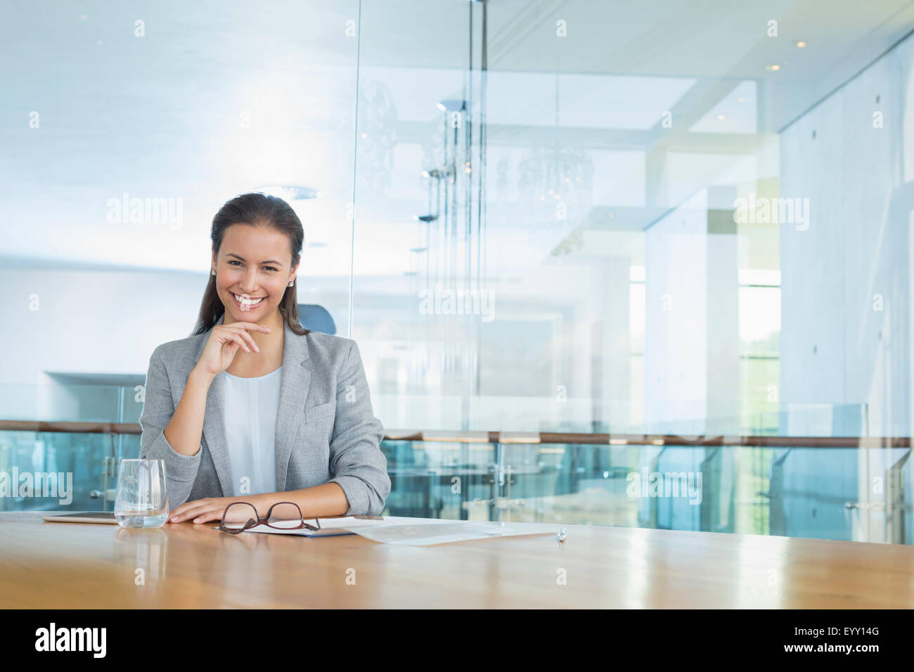 Portrait confident businesswoman at conference room table Stock Photo