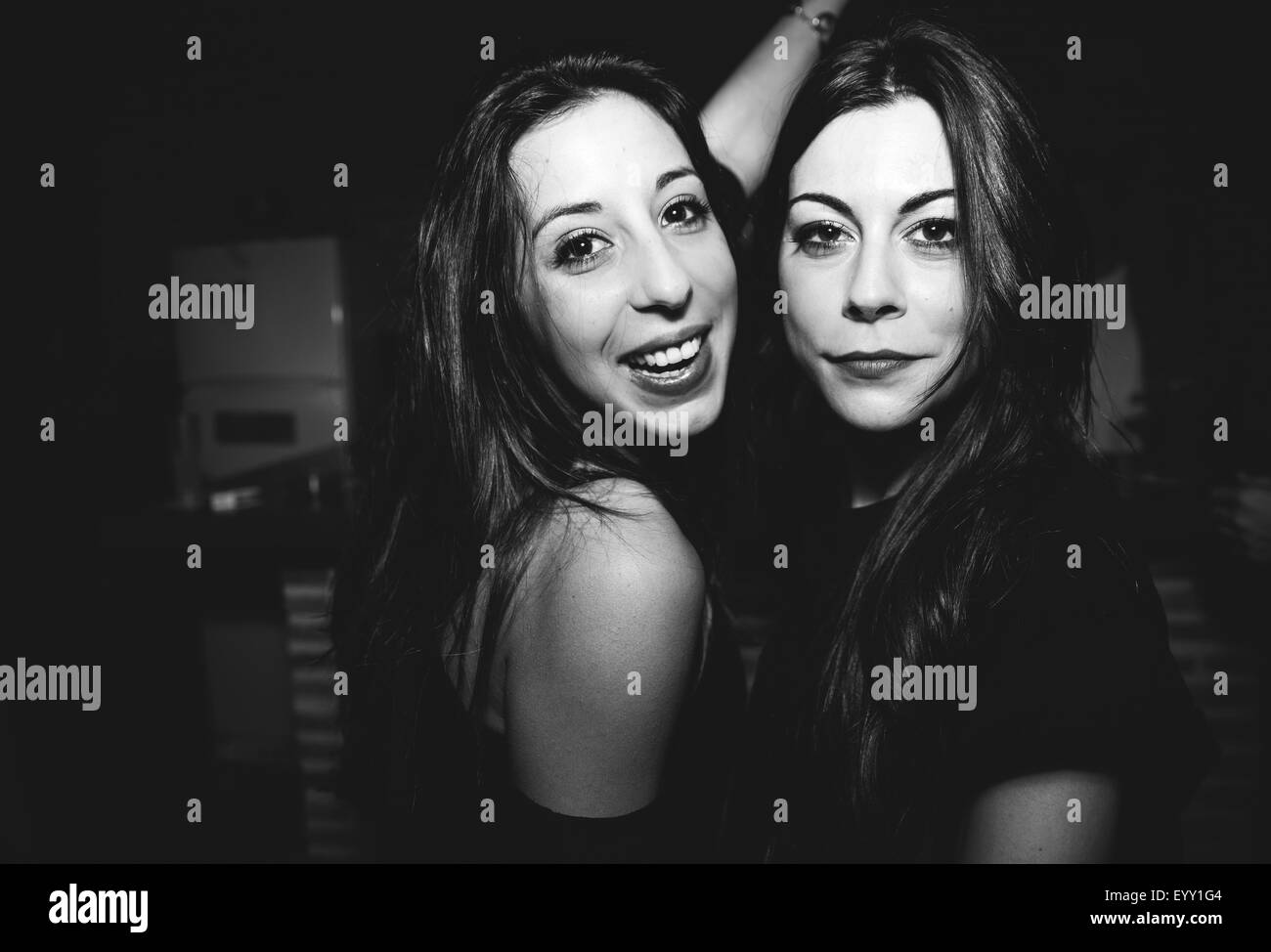 Smiling women dancing in nightclub Stock Photo
