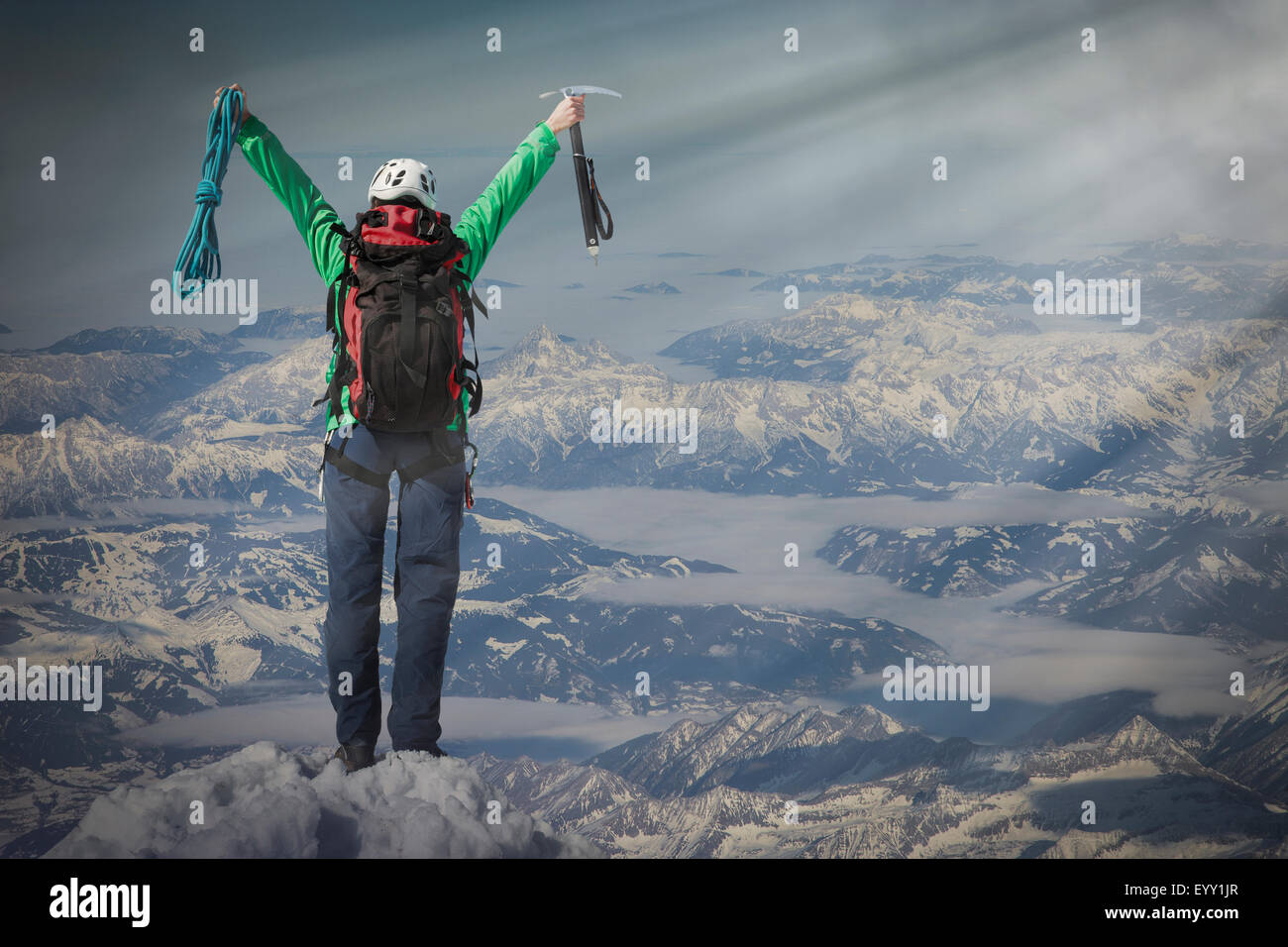 Caucasian hiker cheering on mountaintop, Monte Rosa, Alps, Italy Stock Photo