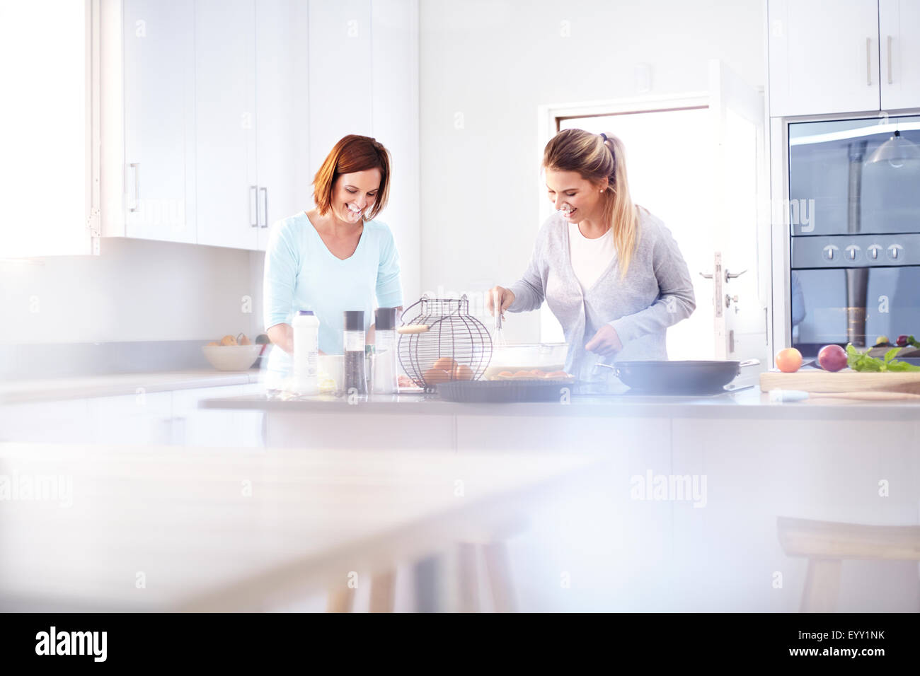 Women baking in kitchen Stock Photo - Alamy