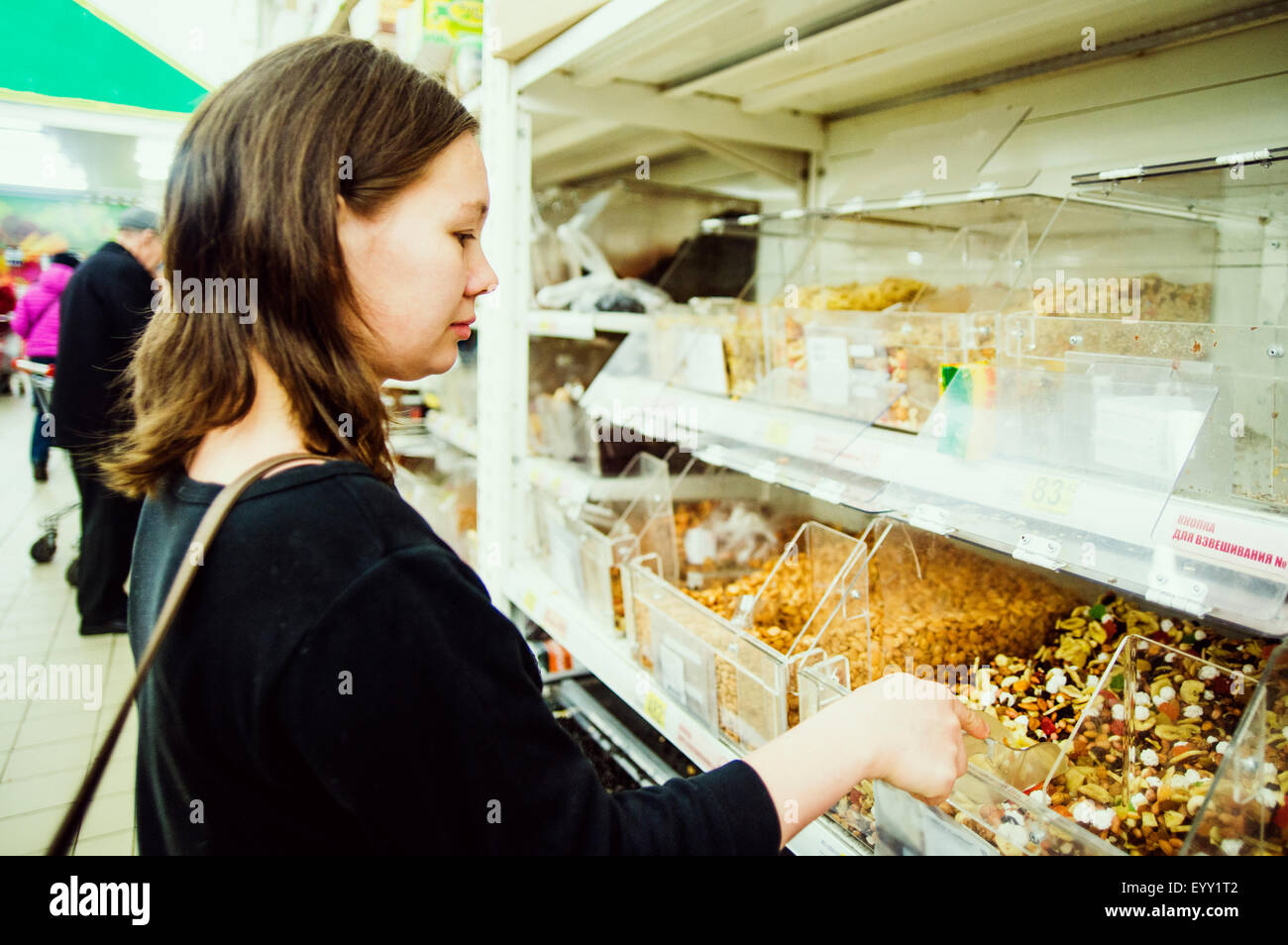 Caucasian woman shopping in grocery store Stock Photo