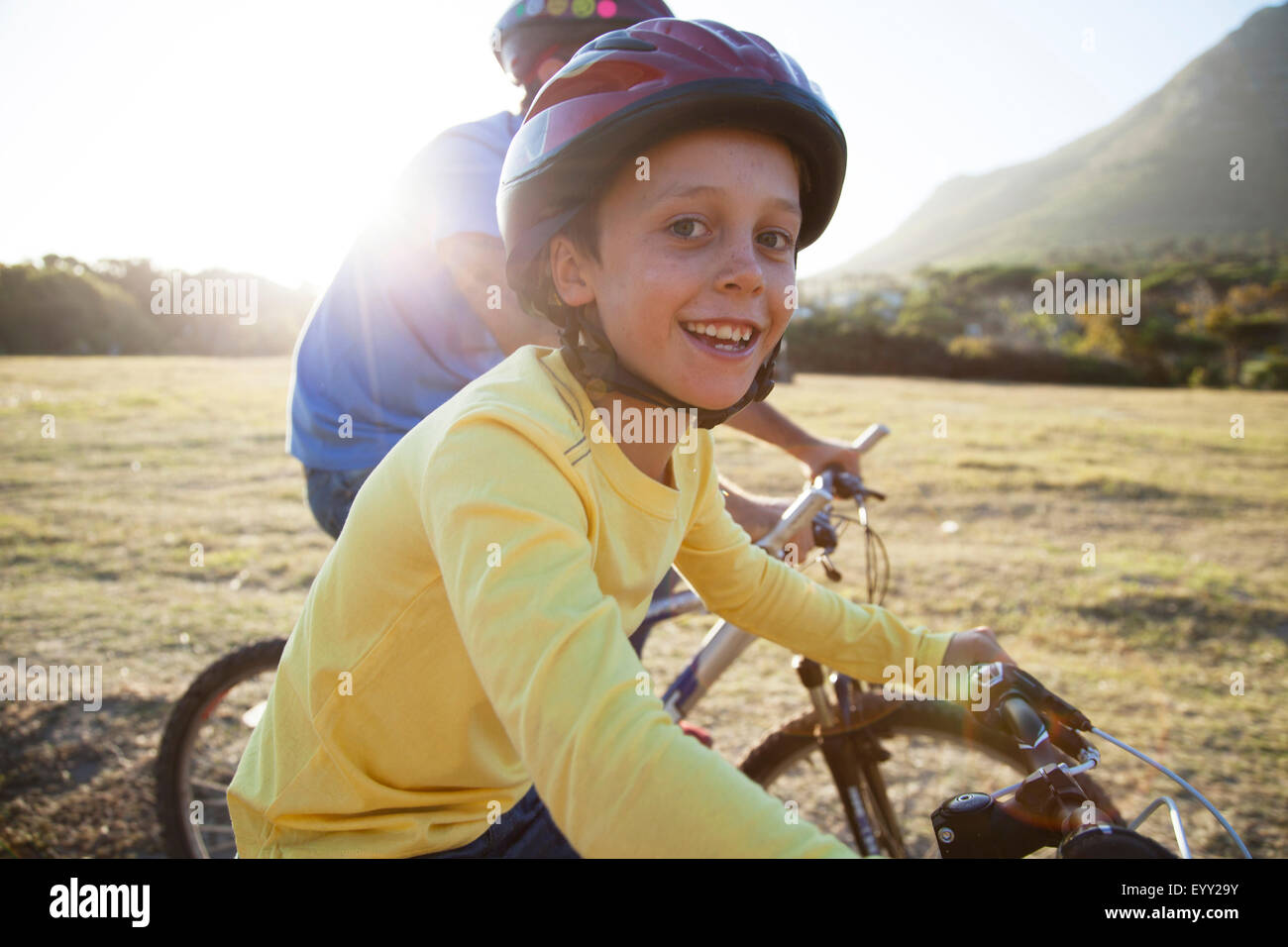 Caucasian father and son riding bicycles Stock Photo
