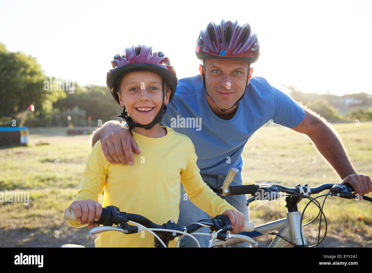 Caucasian father and son riding bicycles Stock Photo