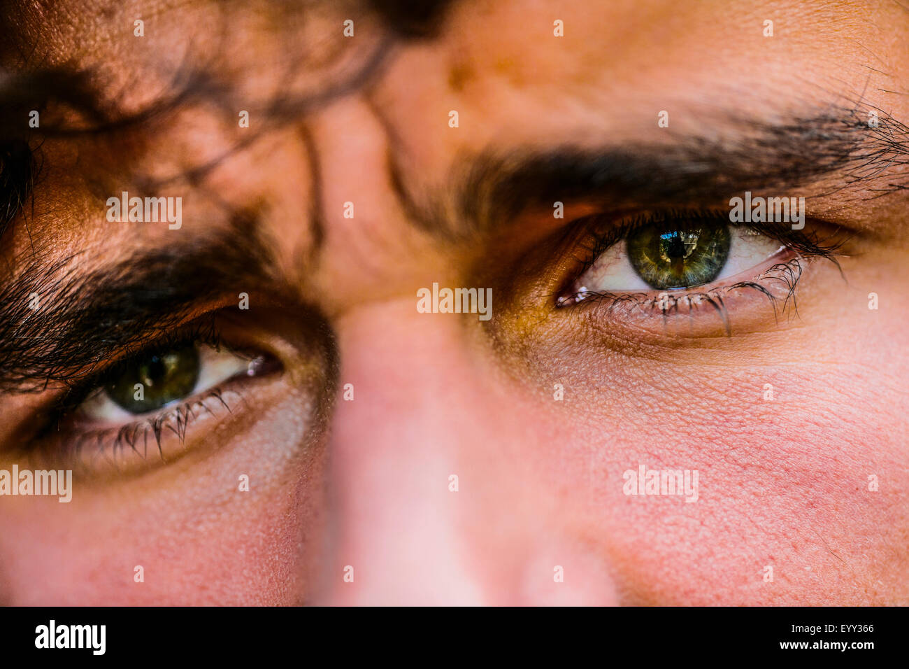 Close up of eyes of Hispanic man Stock Photo