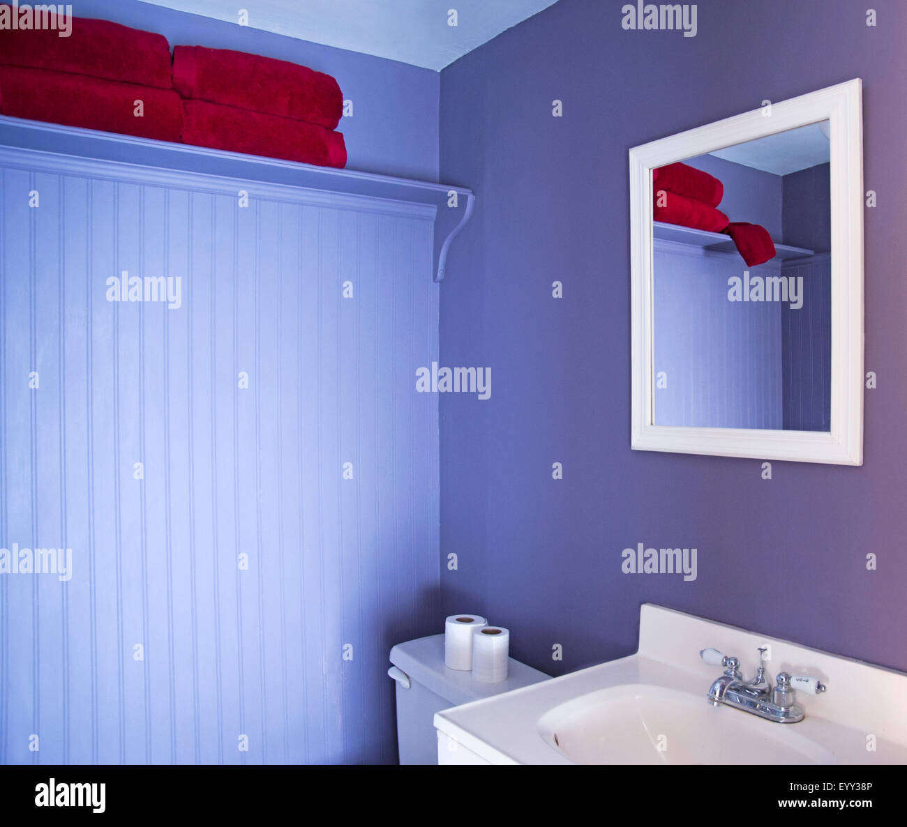 Mirror, sink and toilet in modern bathroom Stock Photo