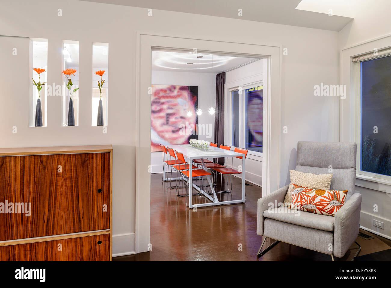 Armchair near entrance to modern dining room Stock Photo Alamy