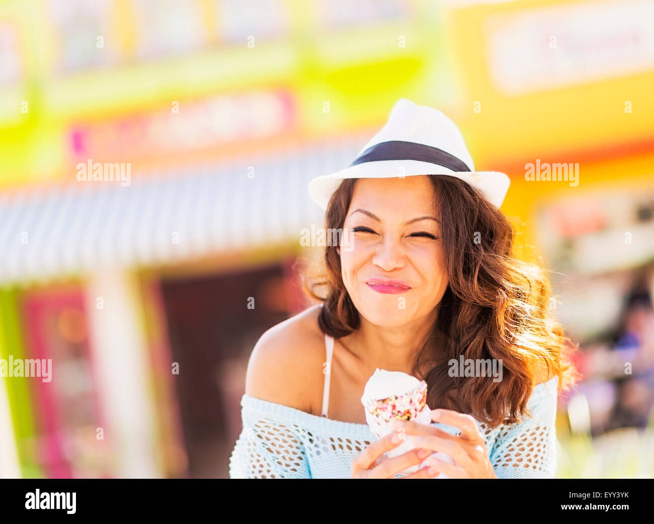 Chinese woman eating ice cream cone Stock Photo
