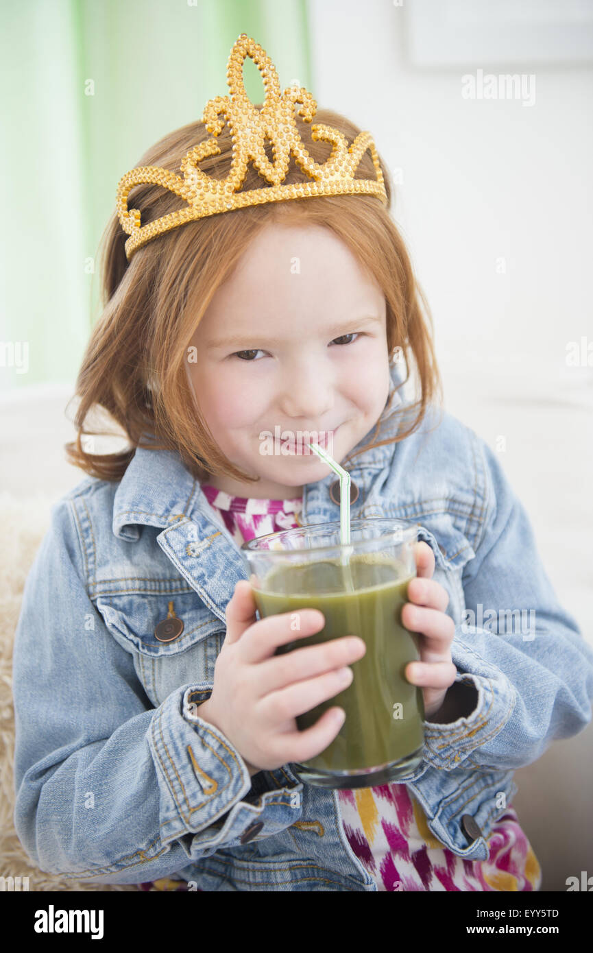Caucasian girl drinking healthy juice Stock Photo