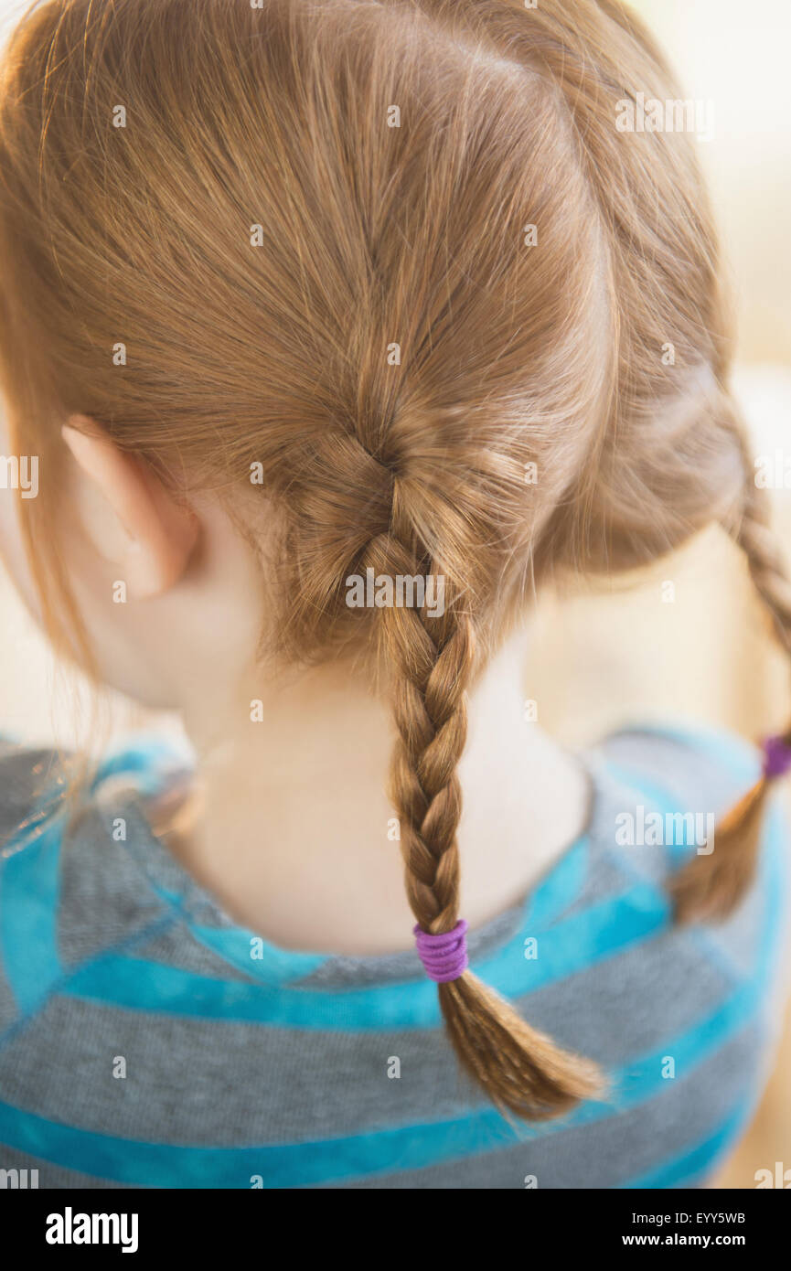 Close up of red hair of Caucasian girl in pigtails Stock Photo