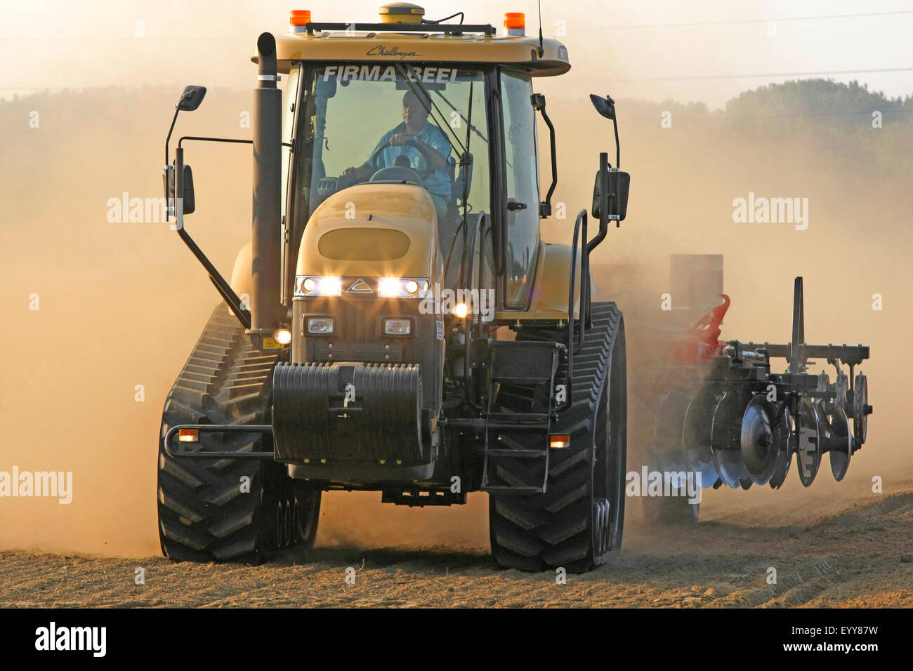 tractor ploughing a field, Netherlands, Zeeland Stock Photo