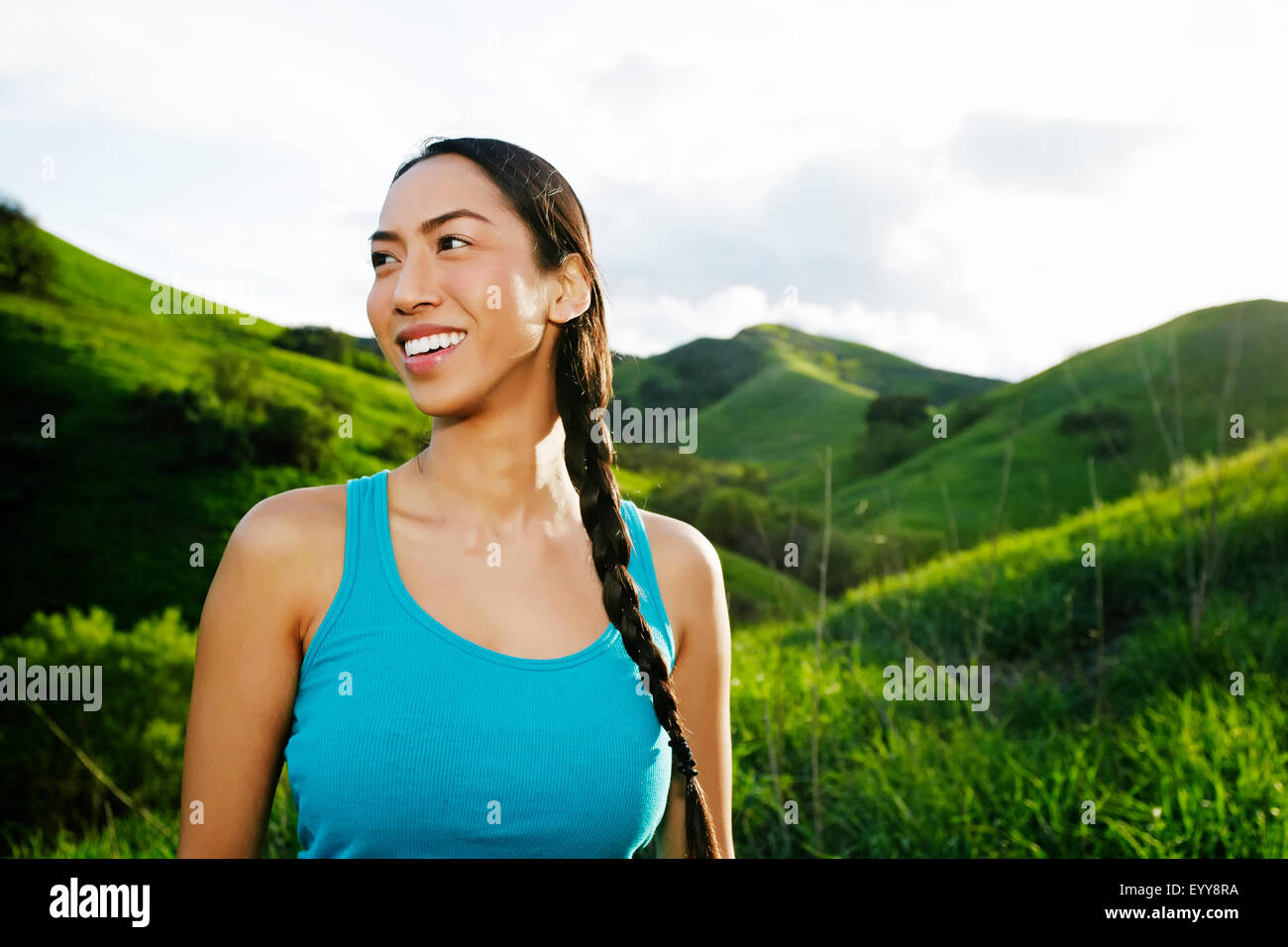 Mixed race athlete standing on rural hillside Stock Photo Alamy