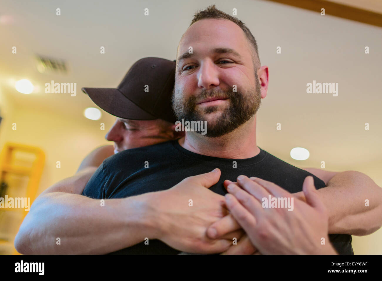 Close up of gay couple hugging Stock Photo