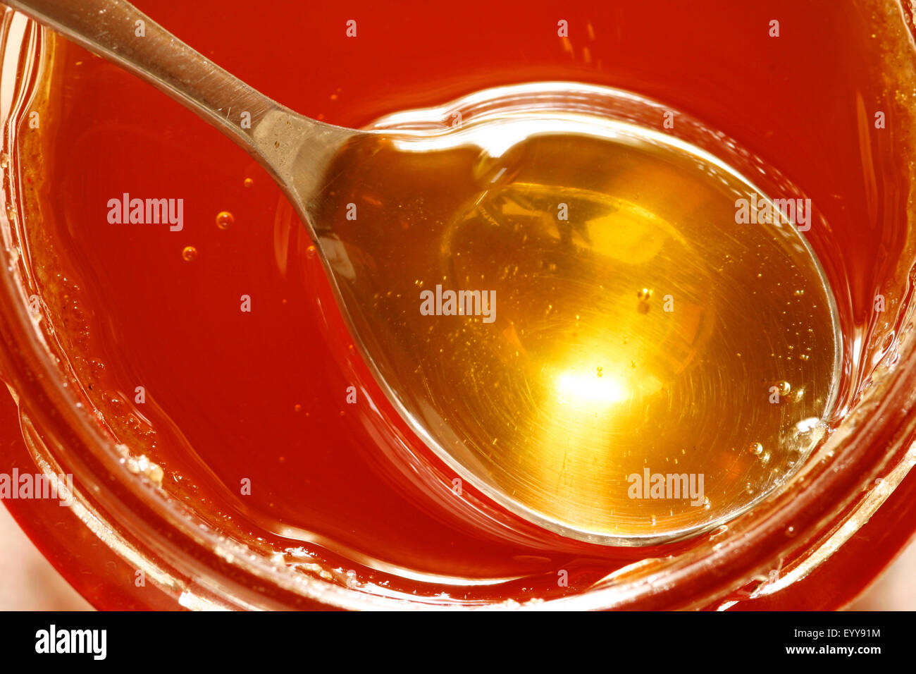 spoon with honey Stock Photo Alamy