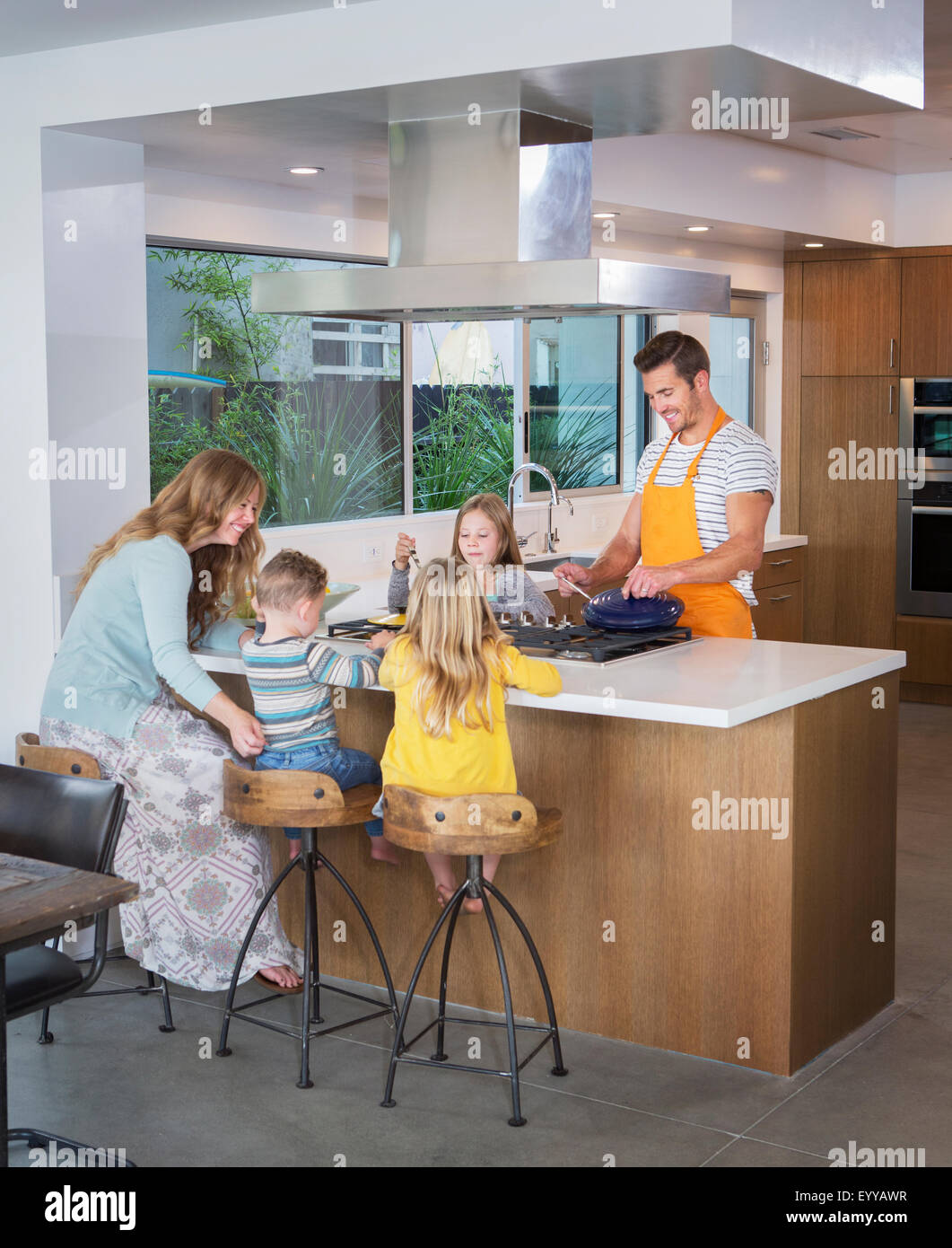 Caucasian family cooking in kitchen Stock Photo