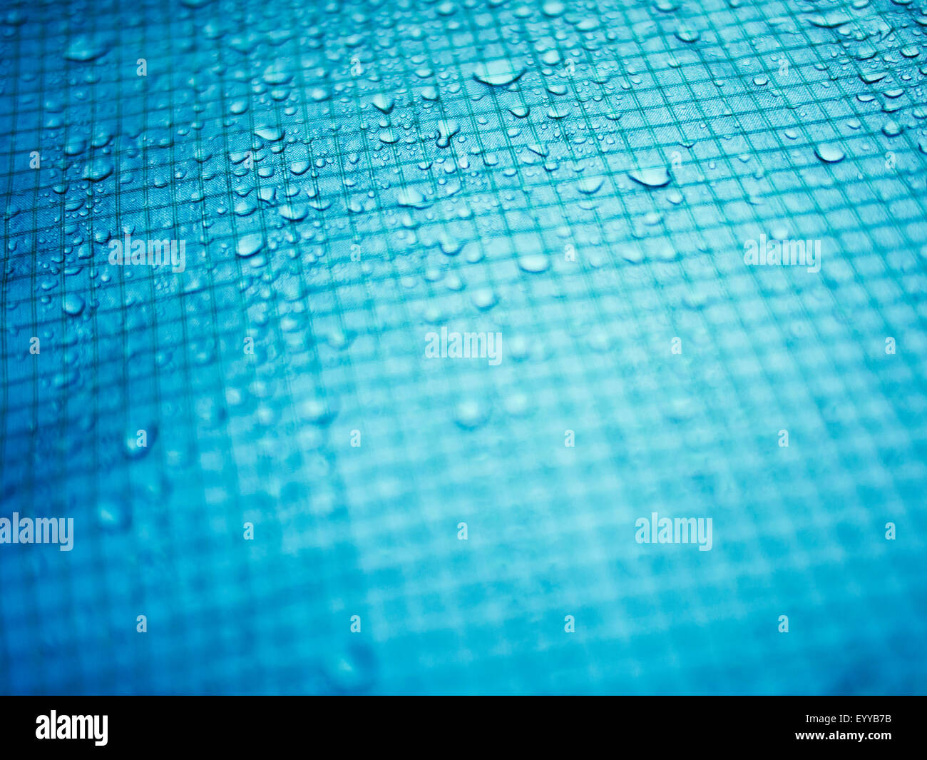 Close up of water droplets on grid surface Stock Photo